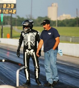 Mark Rendeluk and his crewman Chris walk the dragstrip.