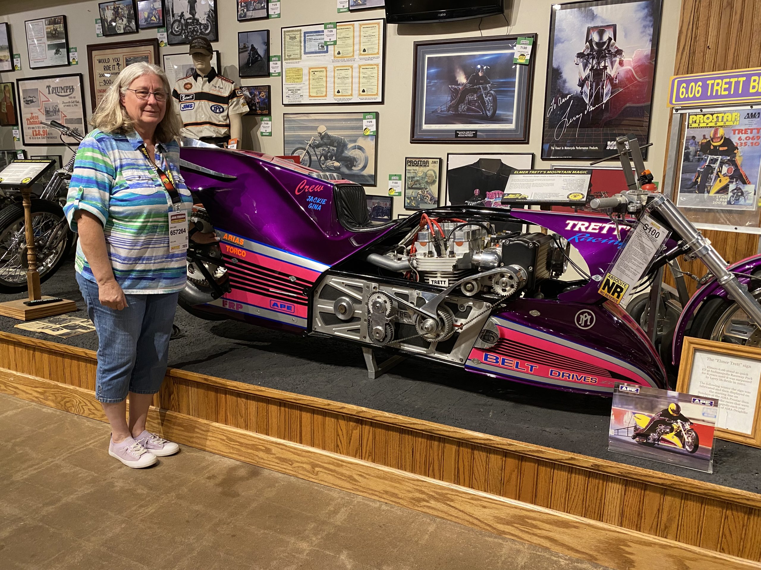Gina Trett next to her father's motorcycle