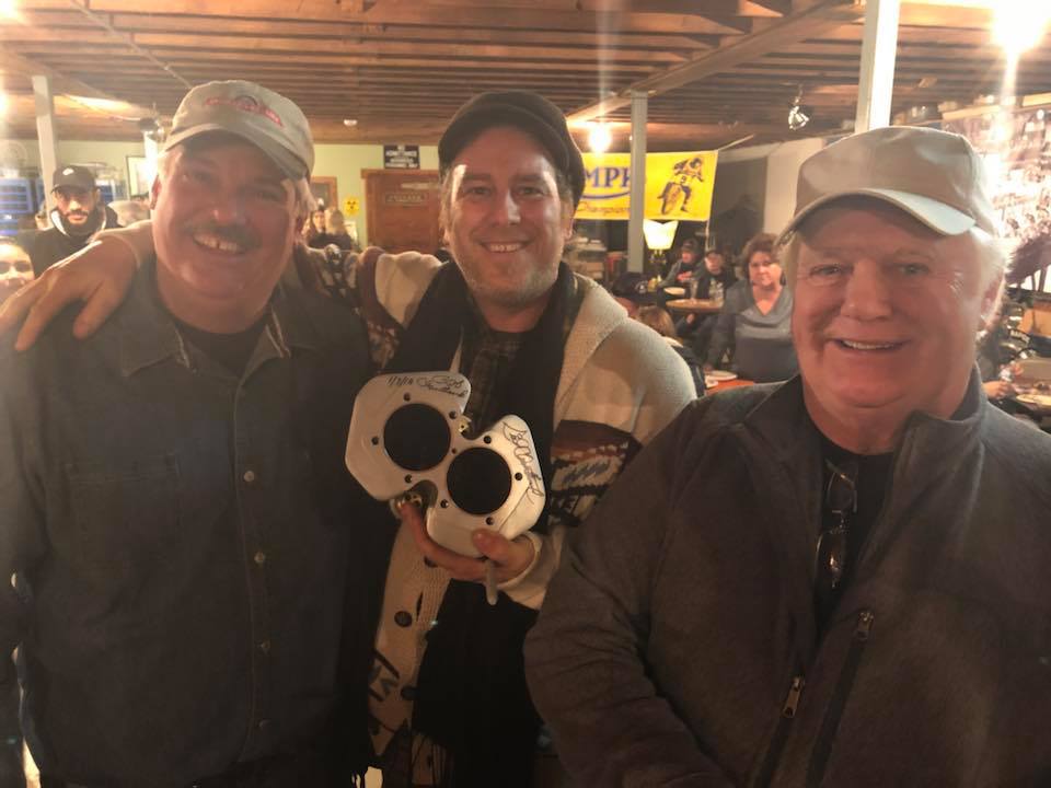 Motorcycle enthusiast Sid Chantland (on the left) was the winning bidder for Elmer Trett's "Mountain Magic 2"